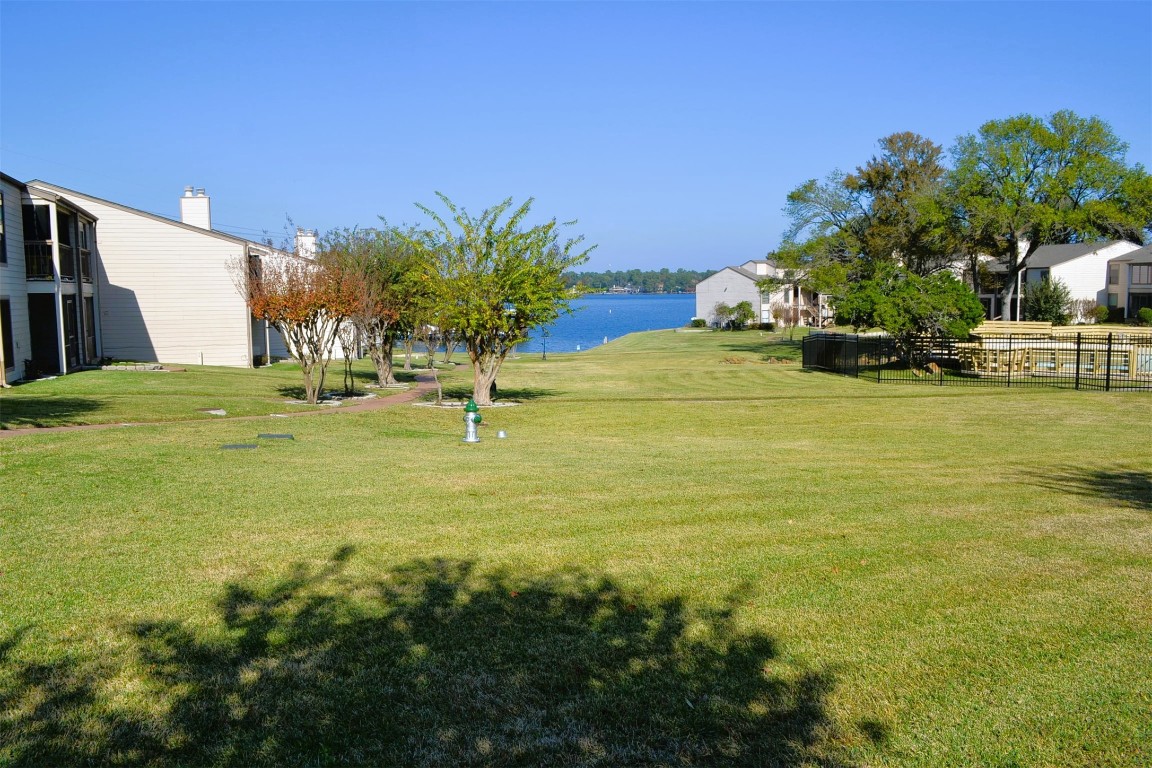 102 Lakeview Terrace, Unit D Conroe, TX 77356 - Photo 2 of 42 a view of an ocean with a house