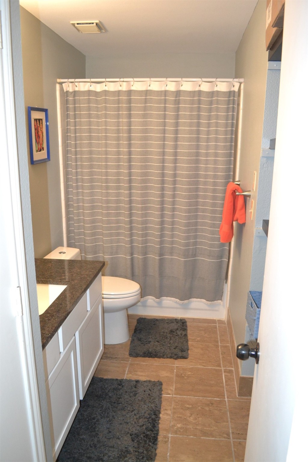 102 Lakeview Terrace, Unit D Conroe, TX 77356 - Photo 21 of 44 a bathroom with a sink and toilet