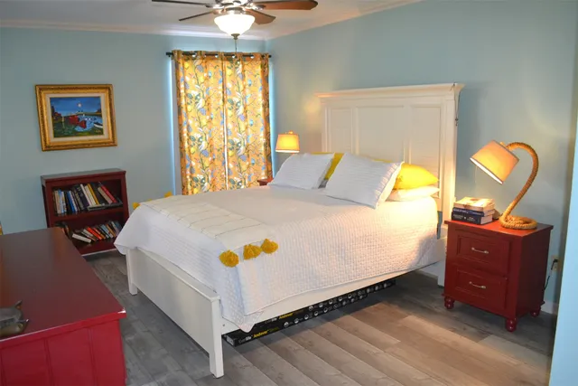 a bedroom with a bed and cabinets