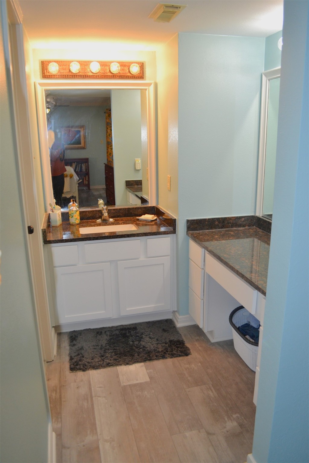102 Lakeview Terrace, Unit D Conroe, TX 77356 - Photo 25 of 44 a view of living room with granite countertop furniture and a fireplace
