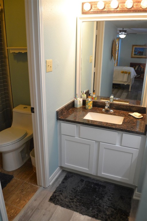 102 Lakeview Terrace, Unit D Conroe, TX 77356 - Photo 26 of 42 a bathroom with a granite countertop sink and a mirror