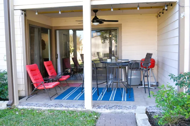 a view of a water fountain in the backyard of house