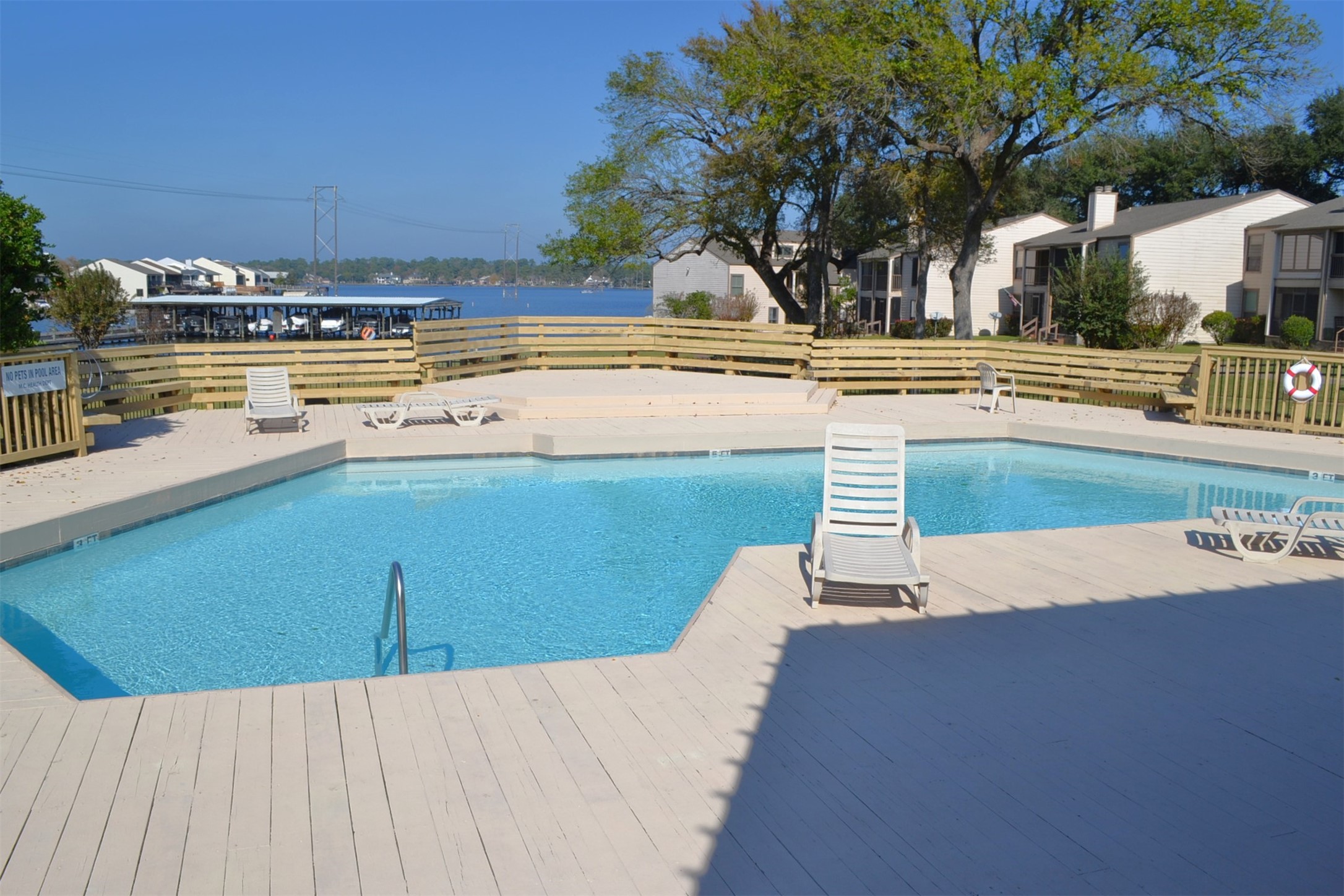 102 Lakeview Terrace, Unit D Conroe, TX 77356 - Photo 40 of 44 a view of a swimming pool with an outdoor space