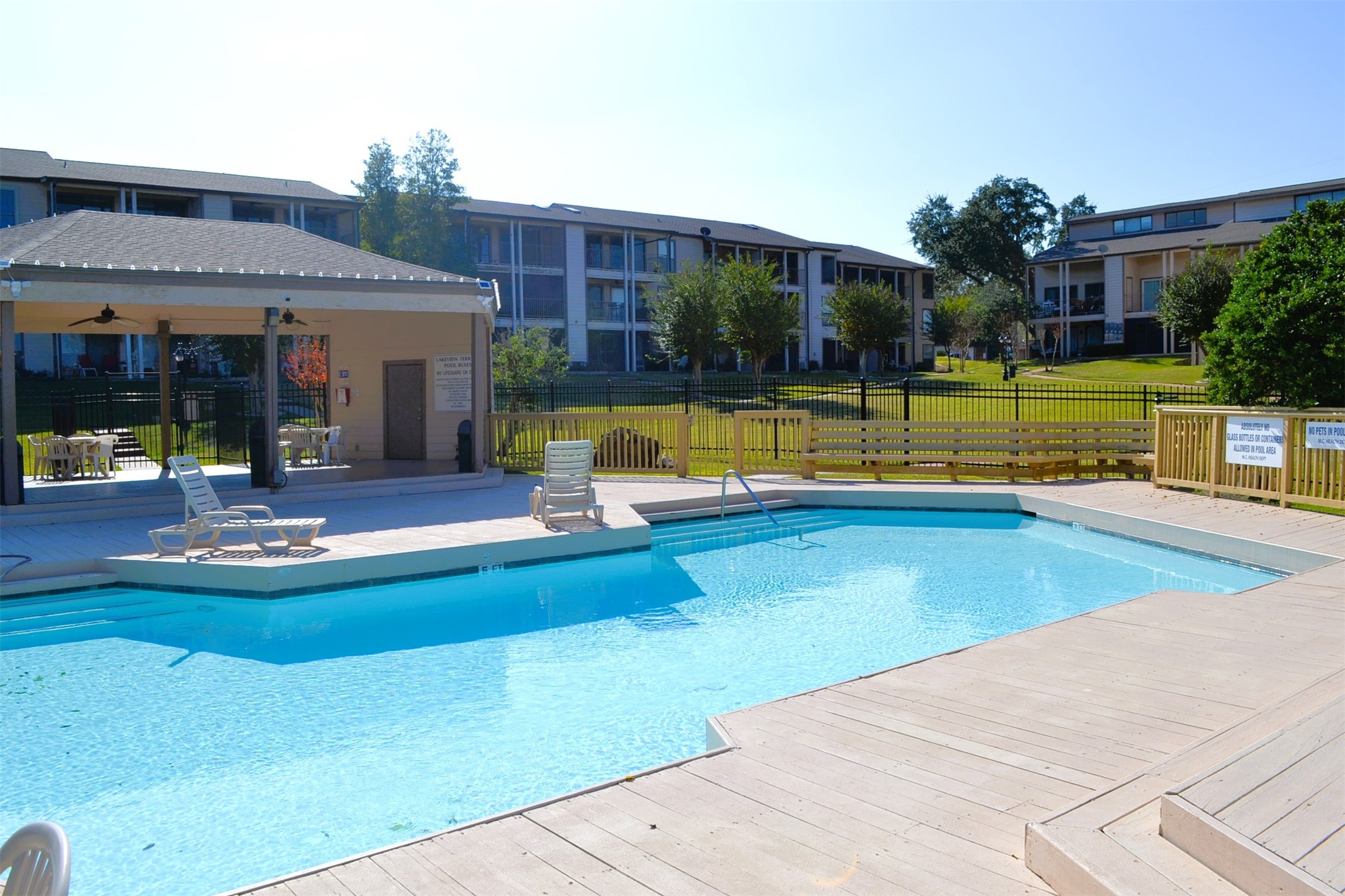 102 Lakeview Terrace, Unit D Conroe, TX 77356 - Photo 42 of 44 a view of a house with swimming pool