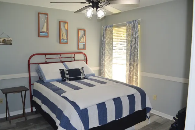 a bedroom with a bed and a window