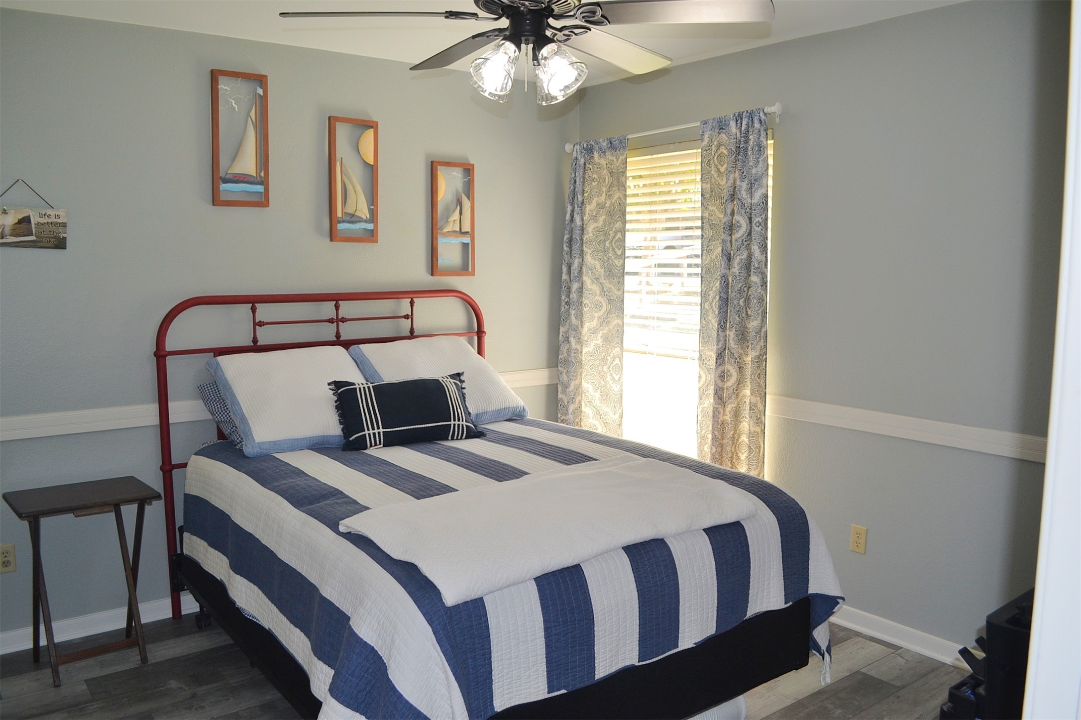 102 Lakeview Terrace, Unit D Conroe, TX 77356 - Photo 6 of 44 a bed sitting in a bedroom next to a window