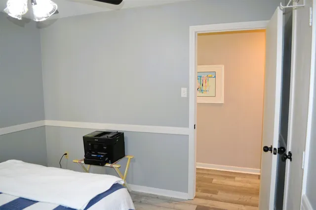 a bedroom with a bed and a table