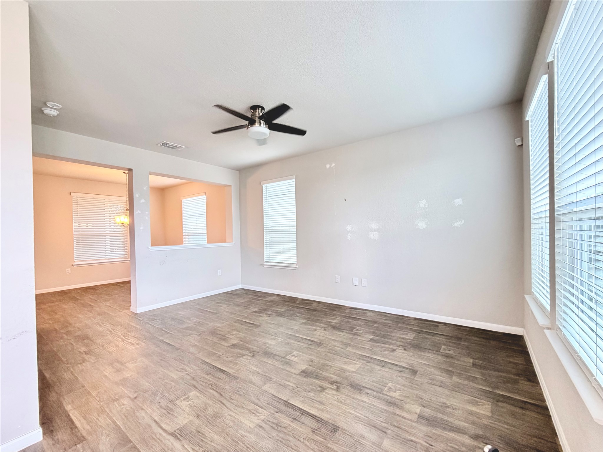 10502 Fulton Avenue Austin, TX 78754 - Photo 7 of 36 Natural light floods this inviting living space, offering an open concept flow to adjacent rooms.