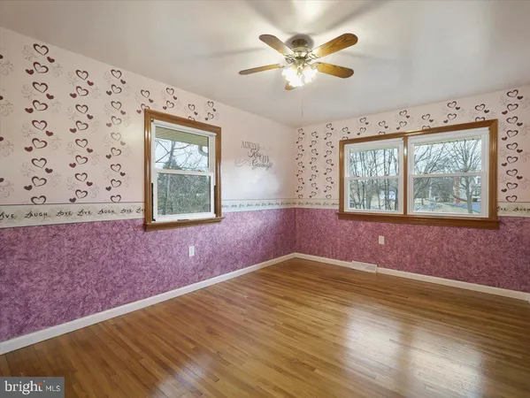 wooden floor that has a window in it