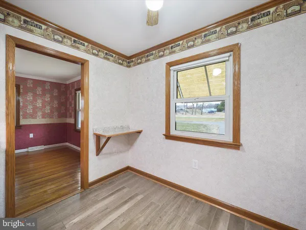 a view of an entryway with wooden floor