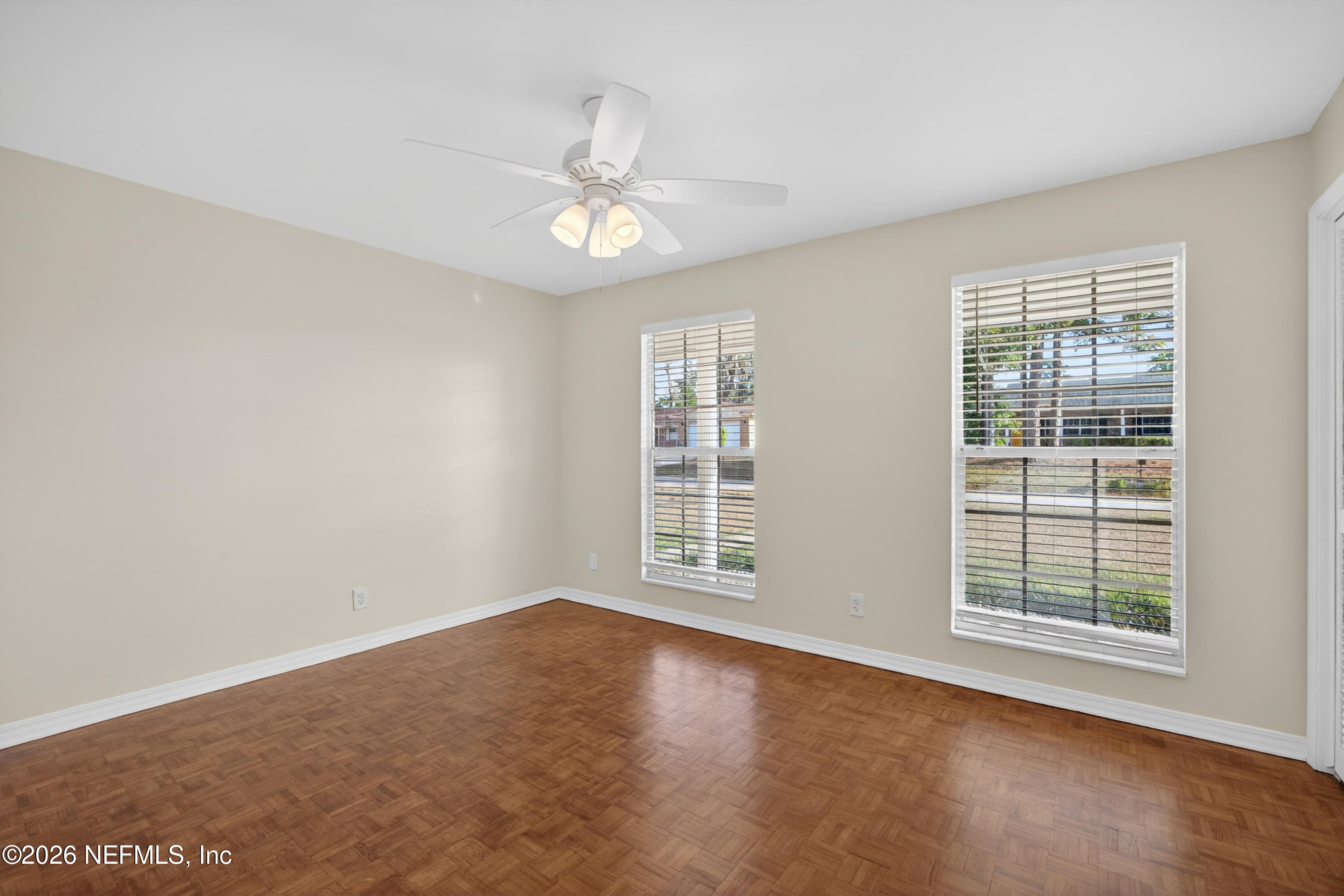 2766 Greenridge Road Orange Park, FL 32073 - Photo 23 of 30 an empty room with windows and fan