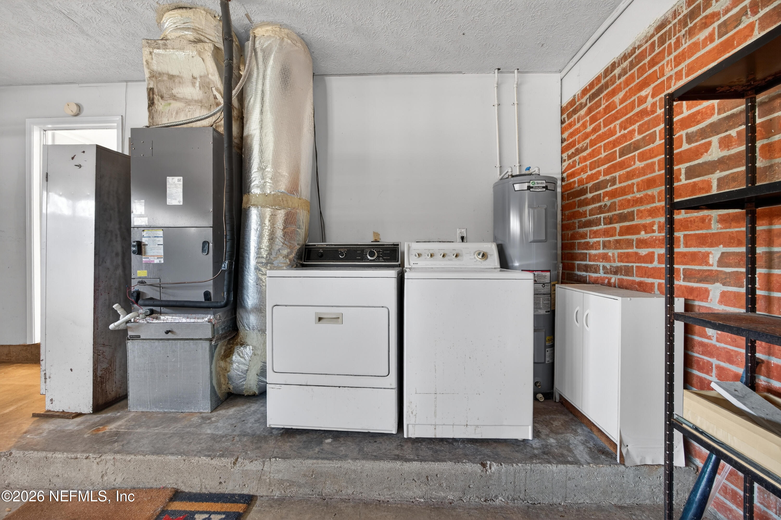 2766 Greenridge Road Orange Park, FL 32073 - Photo 25 of 30 a room with storage and utility