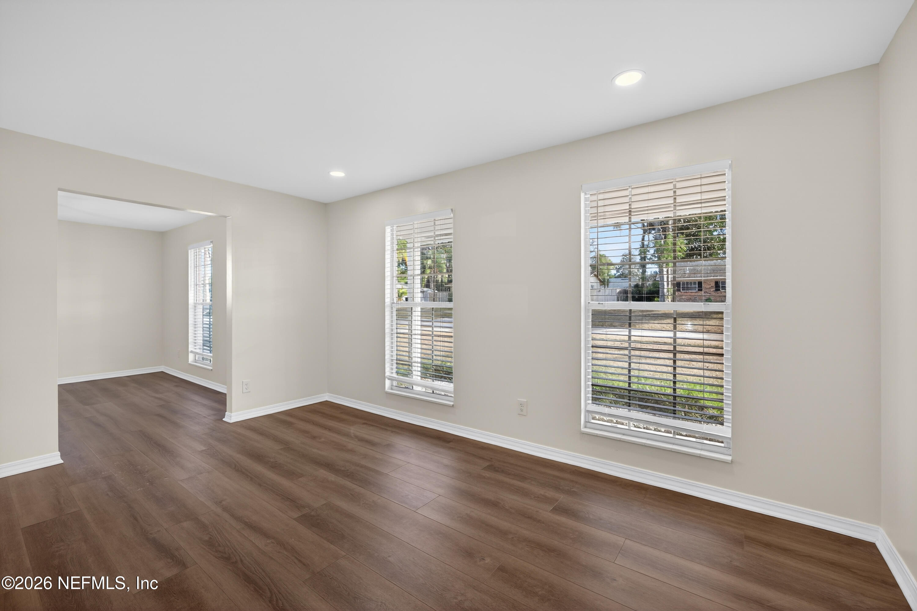 2766 Greenridge Road Orange Park, FL 32073 - Photo 5 of 30 a view of an empty room with wooden floor and a window