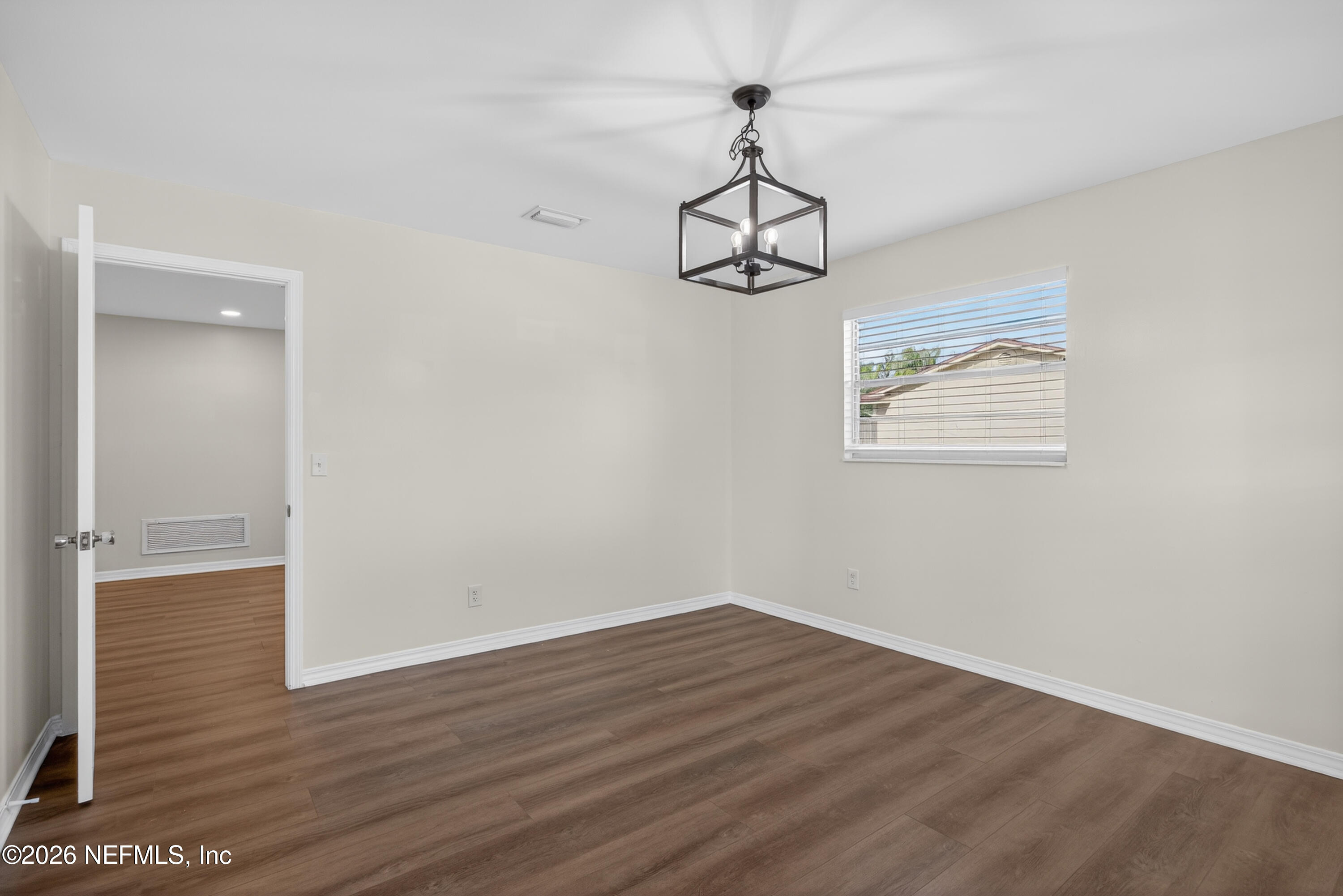 2766 Greenridge Road Orange Park, FL 32073 - Photo 8 of 30 a view of a room with wooden floor carpet and a window