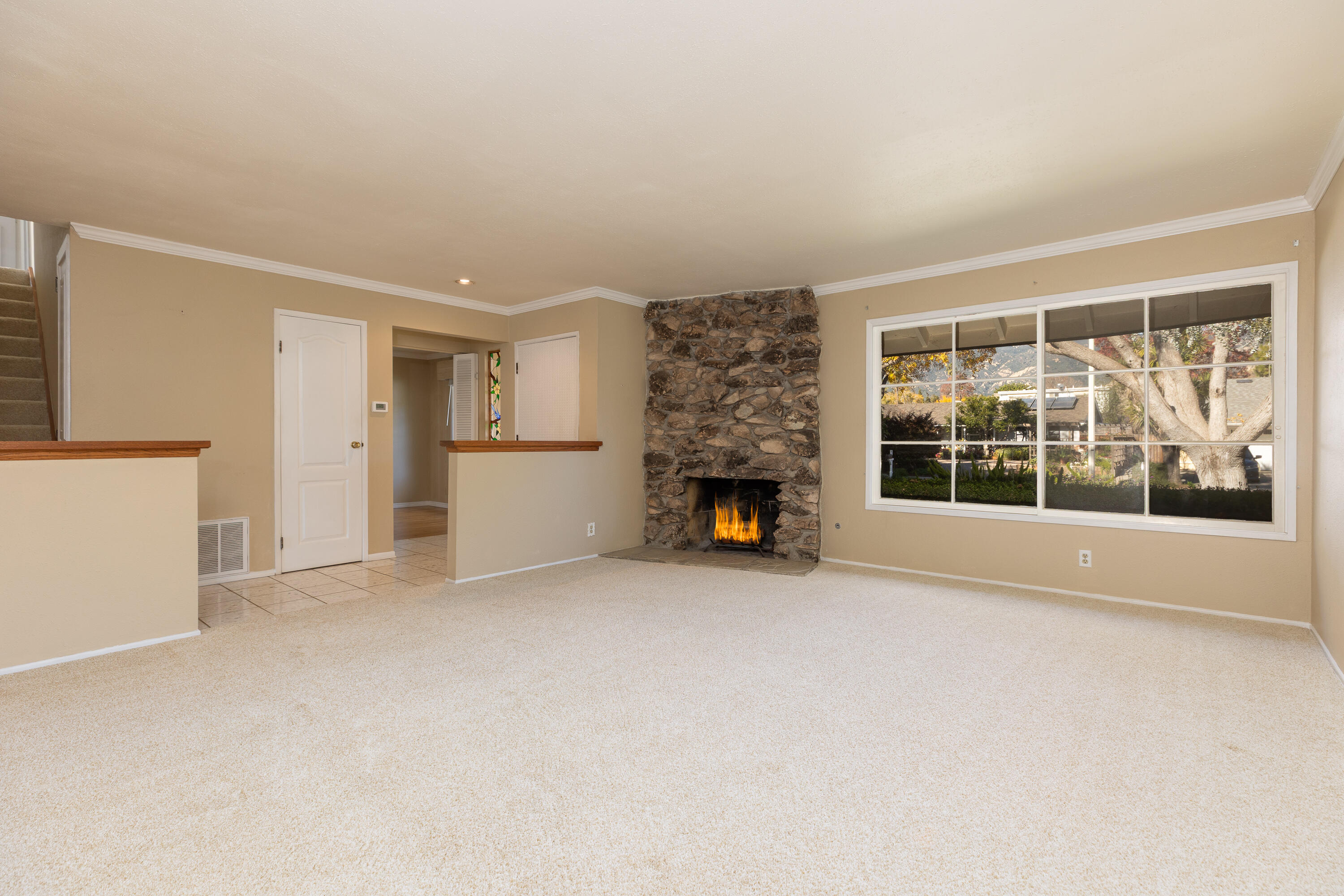 6281 Covington Way Goleta, CA 93117 - Photo 3 of 31 an empty room with fireplace and windows