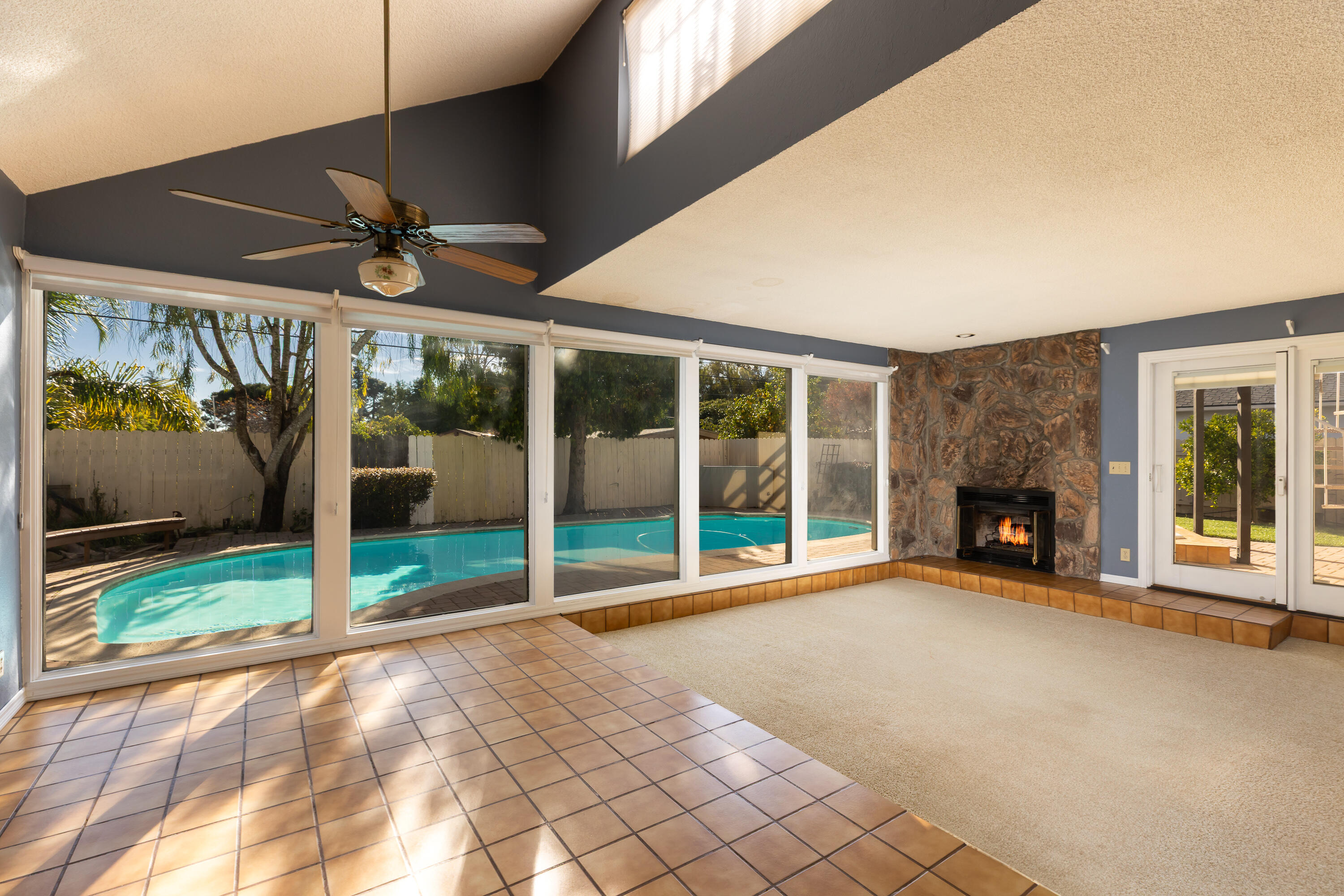6281 Covington Way Goleta, CA 93117 - Photo 8 of 31 a view of an empty room with a fireplace and a large window