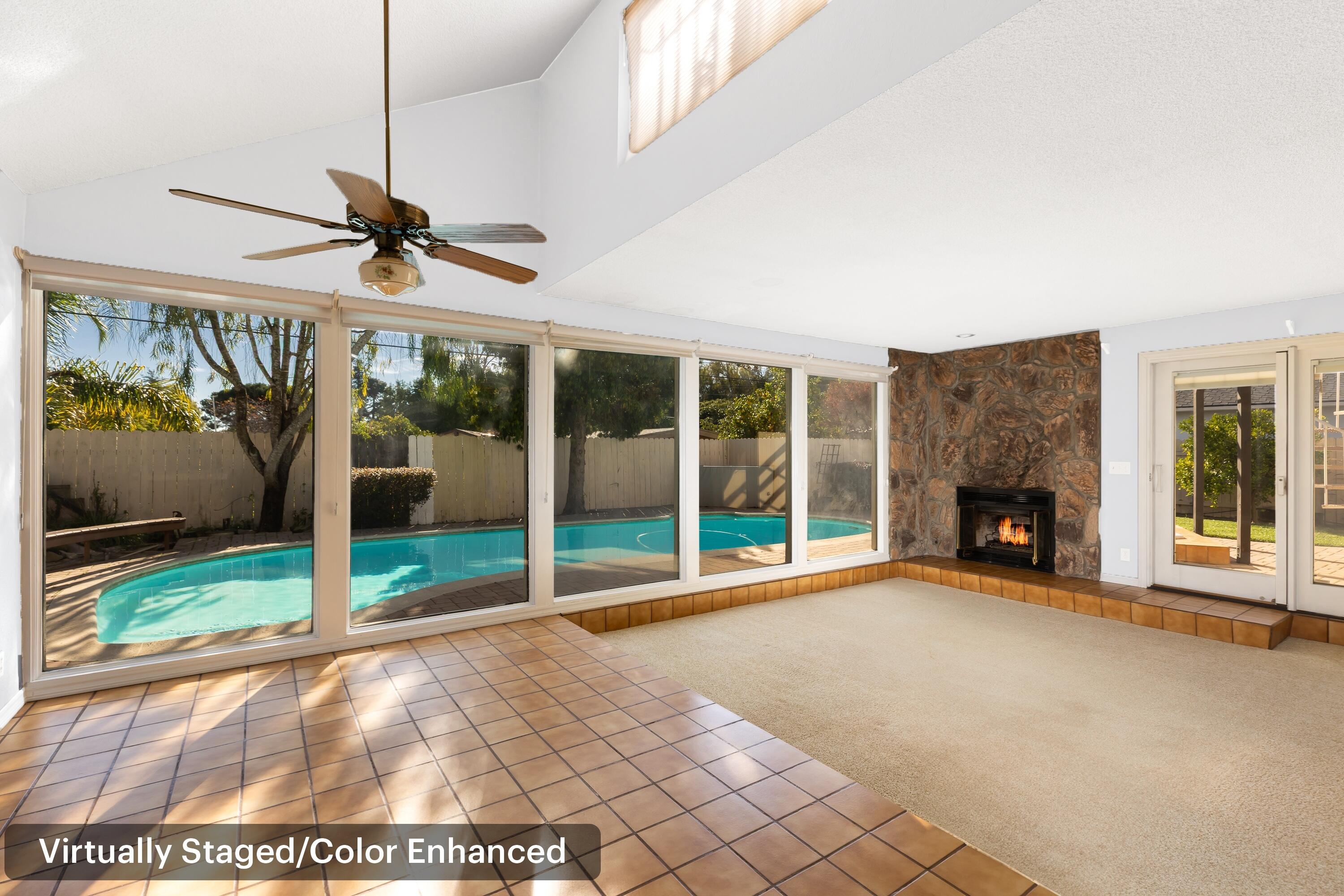 6281 Covington Way Goleta, CA 93117 - Photo 9 of 31 a view of an empty room with a fireplace and a large window