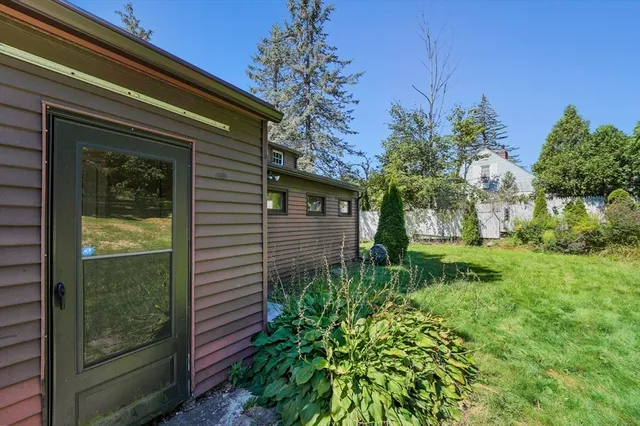 a view of a house with a backyard