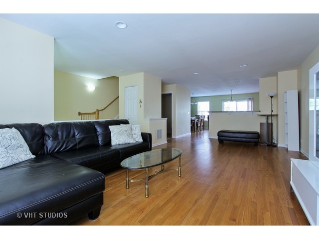 521 George Street, Unit 43 Wood Dale, IL 60191 - Photo 3 of 14 a living room with furniture and a wooden floor