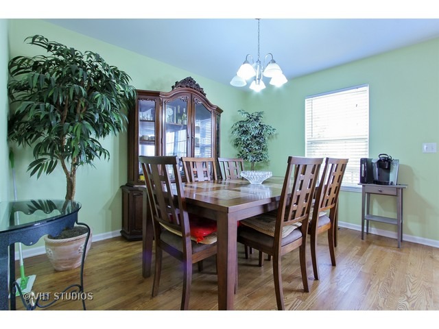 521 George Street, Unit 43 Wood Dale, IL 60191 - Photo 6 of 14 a view of a dining room with furniture and wooden floor