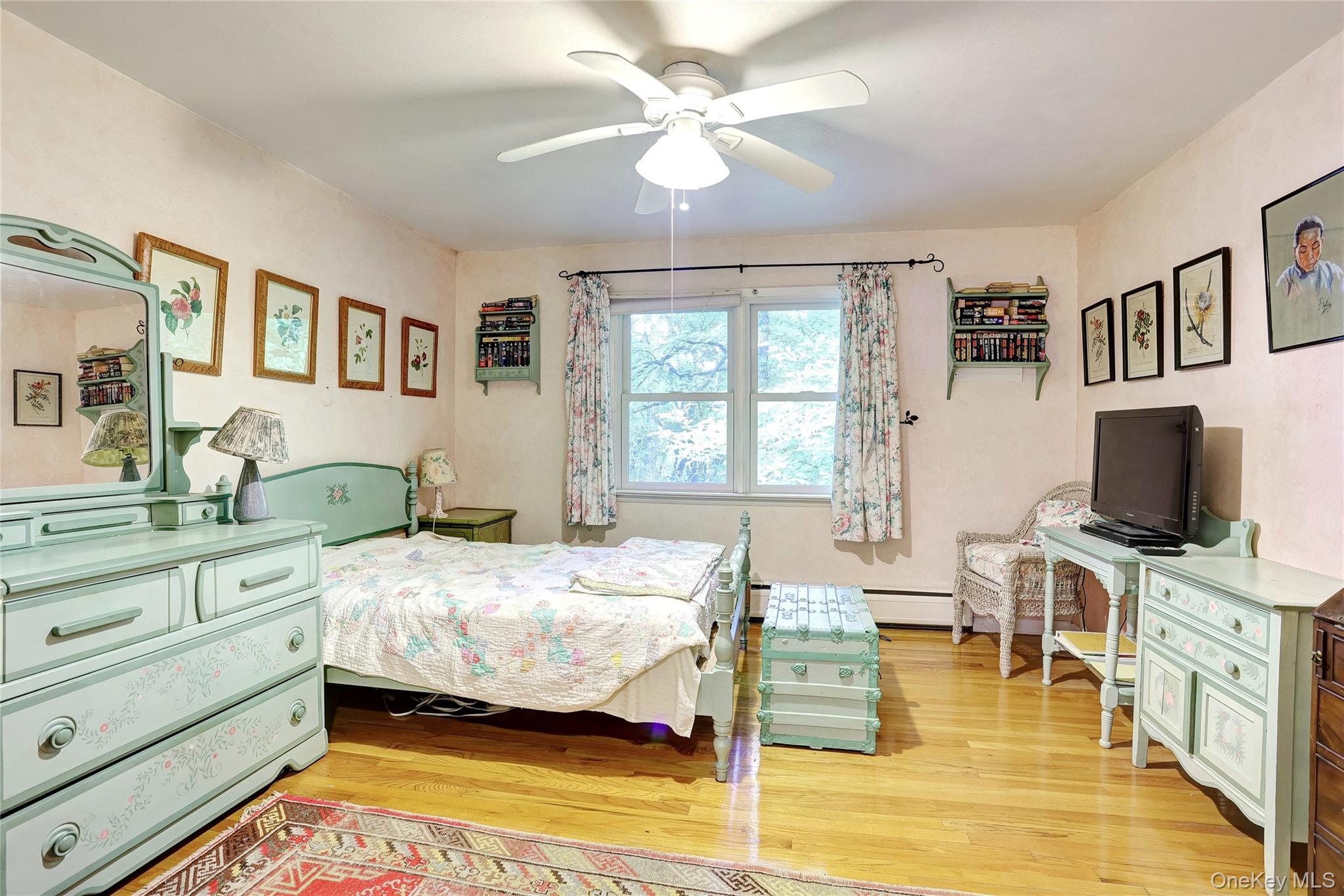 8 Swallow Avenue Spring Valley, NY 10977 - Photo 17 of 28 a bedroom with a bed and a flat screen tv