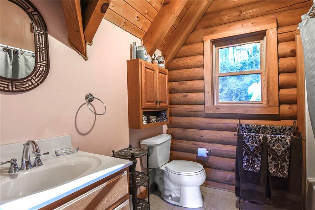 119 Kelly Road Washington, PA 15301 - Photo 17 of 25 The guest bath has a large wooden vanity with an oversized sink. The tub/shower combination is great for guests to use when they stay over