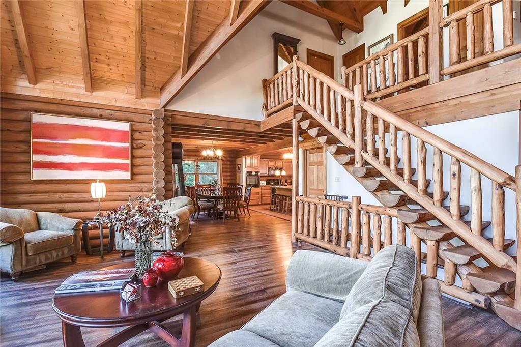 119 Kelly Road Washington, PA 15301 - Photo 7 of 25 This grand log staircase leads you up to the second level of the home where you can overlook the Living Room and maybe sneak a peak of the Dining Room too