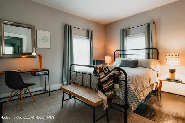 a bathroom with a toilet and a shower curtain