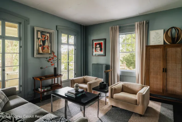 a lobby with furniture and floor to ceiling window