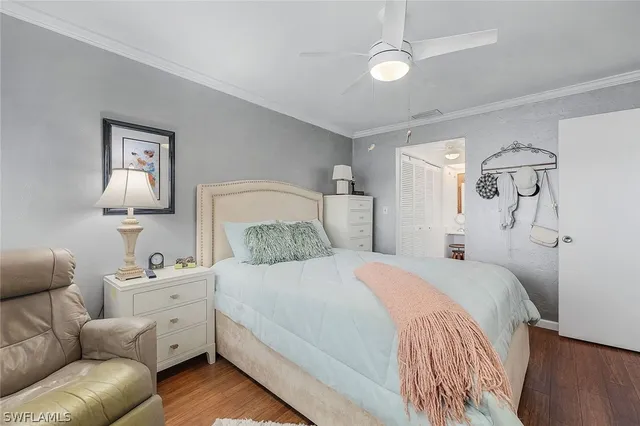 a bedroom with a large bed and a couch