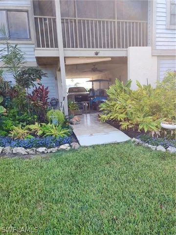 a view of a patio with a table and chairs in patio