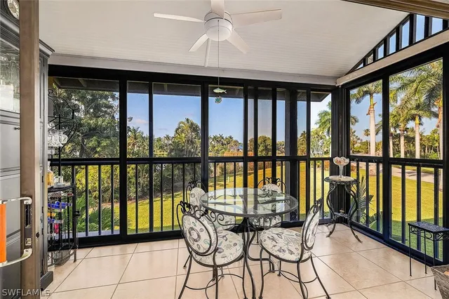 a view of a balcony with chairs and wooden floor