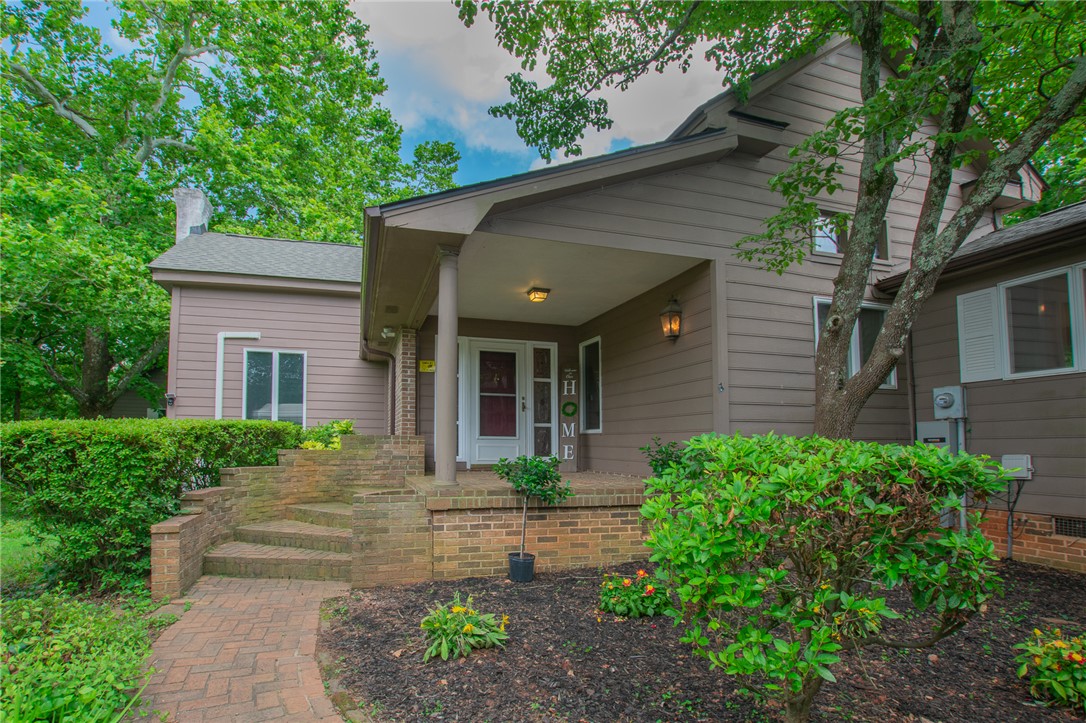 200 Chenault Road Townville, SC 29689 - Photo 4 of 47 A welcoming brick pathway leads to the inviting front porch of this charming residence.