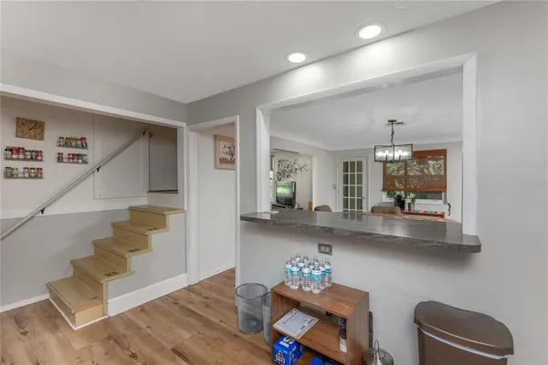 a view of entryway and kitchen