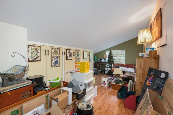a living room with furniture and a lamp