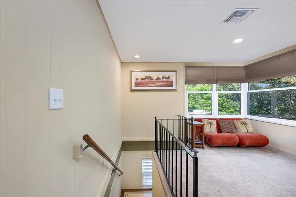 a view of a room with furniture wooden floor and window