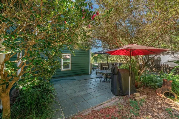 an outdoor space with furniture and umbrella