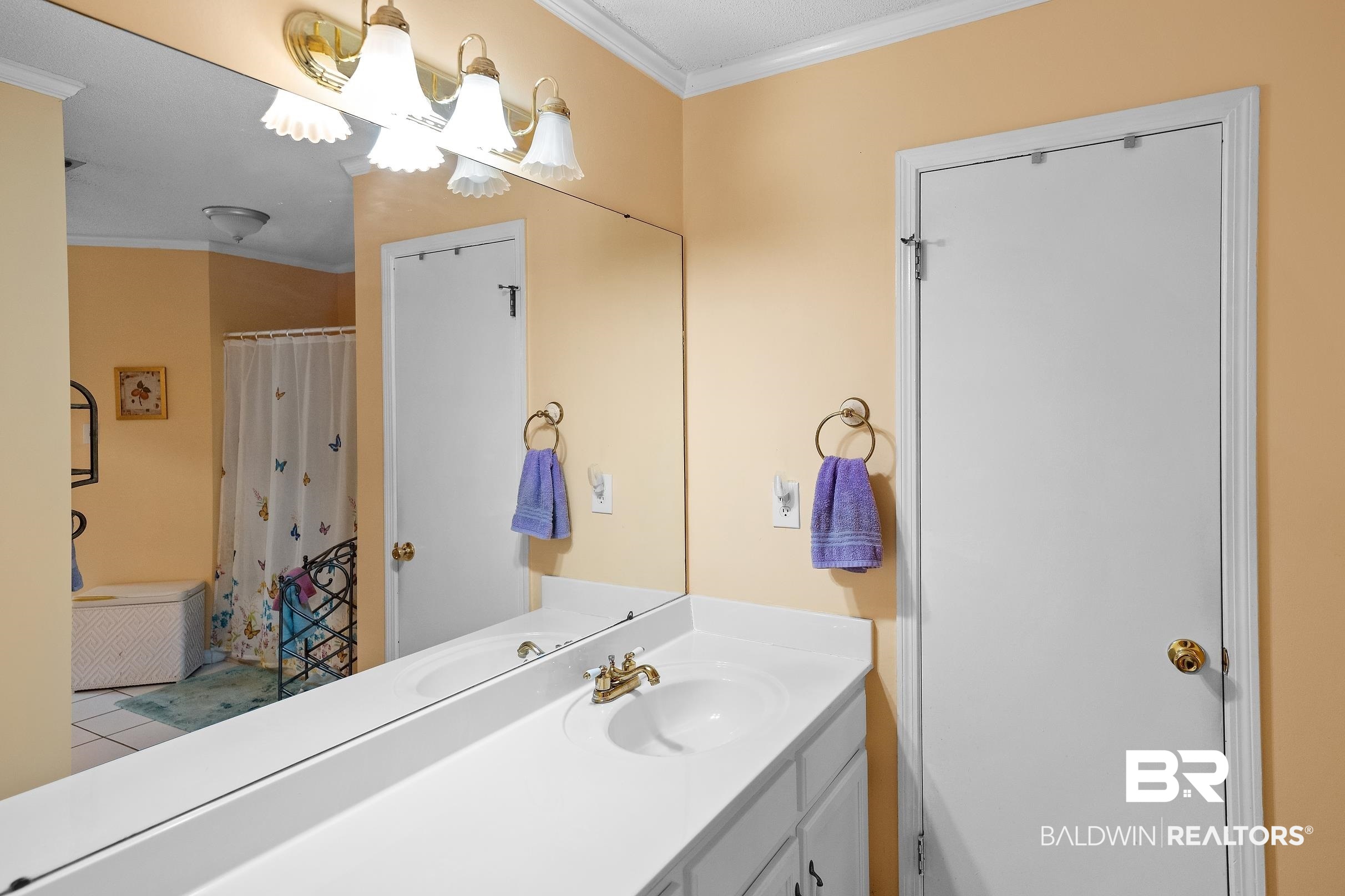 4026 Kingsrow Row Mobile, AL 36619 - Photo 24 of 51 Full bathroom with ornamental molding, a shower with shower curtain, and vanity