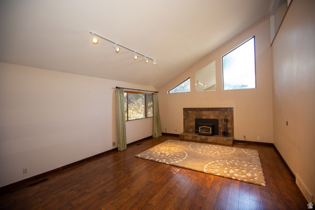 1500 Sumac Drive Logan, UT 84321 - Photo 10 of 42 Great room featuring a vaulted ceiling and wood-finish flooring