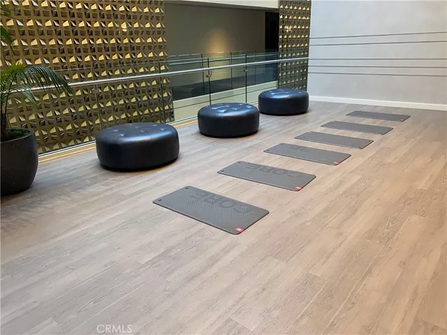 a room with gym equipment and a view of living room