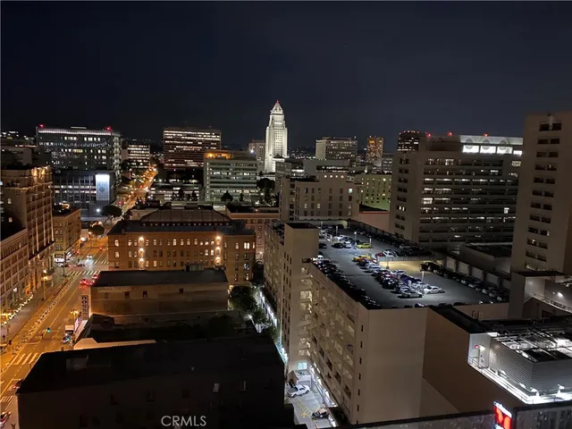 a room with furniture a flat screen tv and potted plant