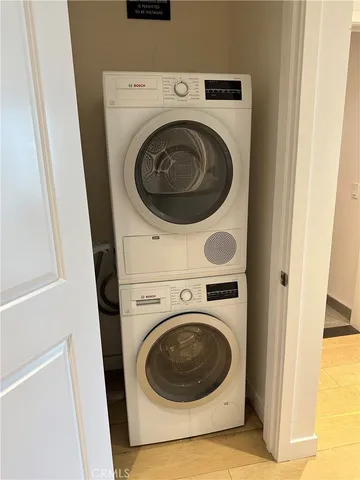 a kitchen with stainless steel appliances granite countertop a refrigerator a stove a sink and a microwave