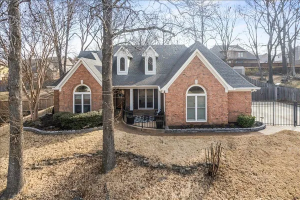 a view of a house with a yard covered in snow