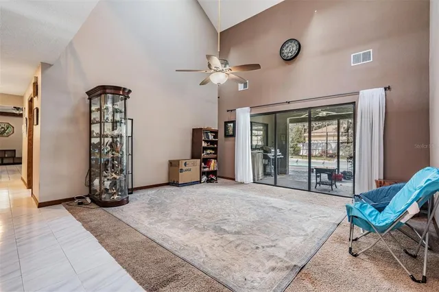 a view of a livingroom with furniture and a flat screen tv