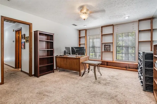a bathroom with a tub shower and mirror