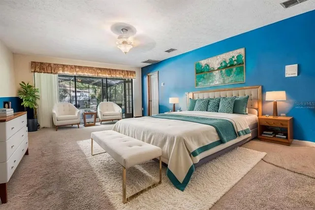 a view of a bathroom with mirror and a sink