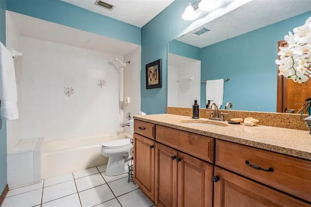 a room with a baby crib and a dresser