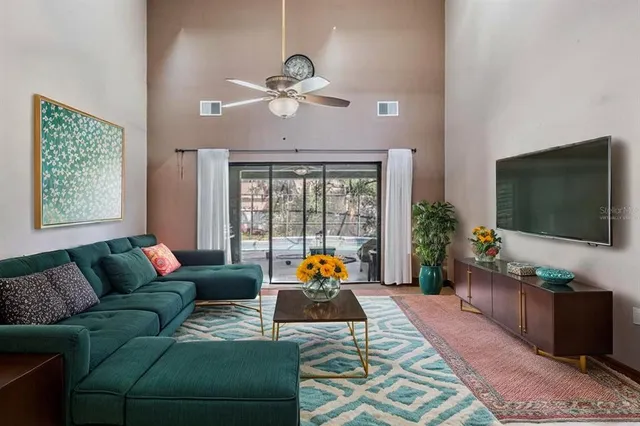 a view of a livingroom with lounge chair and chandelier