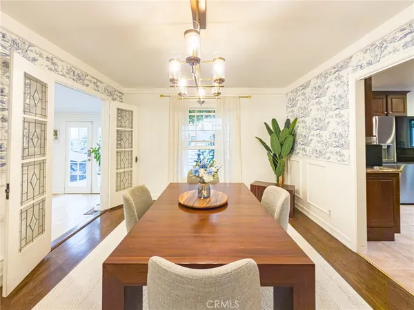 a dining room with furniture and window