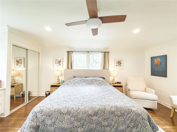 a spacious bedroom with a bed and a couch
